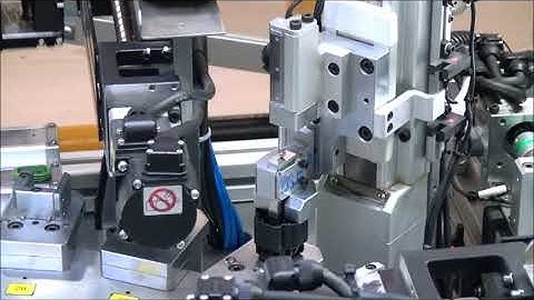 Assembly line for automotive wire harness connector