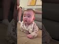 Baby celebrating her first rollover