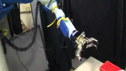 Experiments on grasping of a flight recorder with a robotic arm