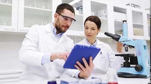 Scientists With Tablet Pc And Microscope In Lab 1 | Stock Footage - Envato elements