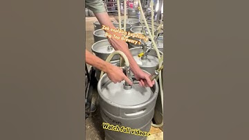 ￼Zak explains the finer points of kegging Big Top beer. ￼