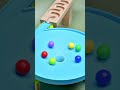 Colorful marbles are rolling into the hole. #satisfying