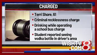 Charges filed after school bus driver caught drinking vodka from juice bottle while driving