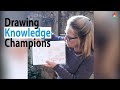 Knowledge champion satu  explains her drawing of knowledge champions