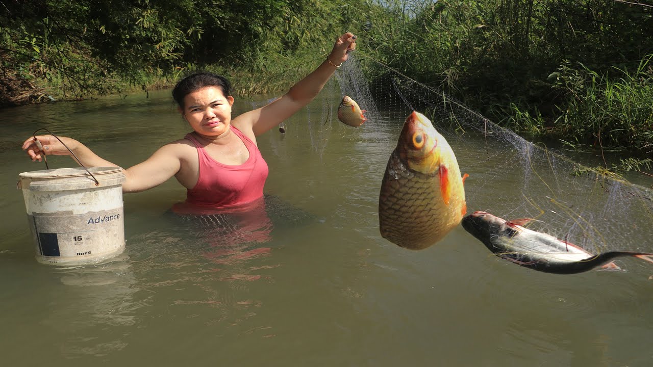 Girl fishing in river
