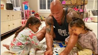 Celebrity The dwayne johnson (The Rock) playing with his two daughters Profile