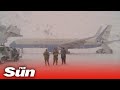 Biden stuck on Air Force One for 30 minutes as severe snow storm hits Maryland