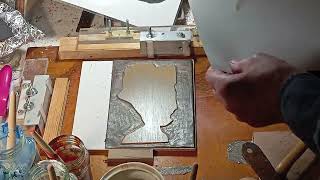 Combining wax carving wood block printing.