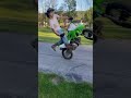 Kid wrecks his dirt bike doing a wheelie