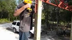 Build your own carport with steel trusses.