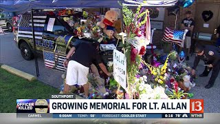 Steady stream of visitors to memorial to fallen officer