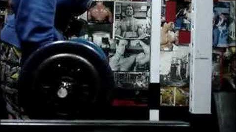 Michael Gundill performs biceps curls with elastic band