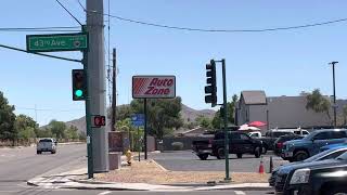 Triple 8 / Double 12 5 section traffic light at an intersection.