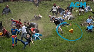Cheesy chaos: daredevils hurl downhill in wild UK cheese rolling race