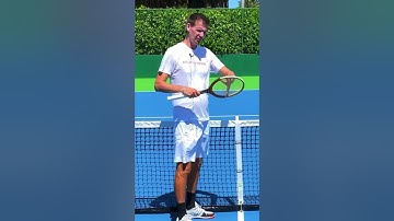 Measure the tennis net with your racquet