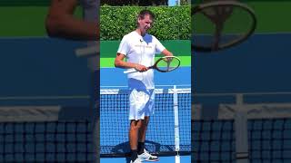 Measure the tennis net with your racquet