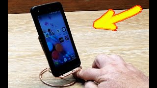Incredibly simple idea of a phone stand made with your own hands .
