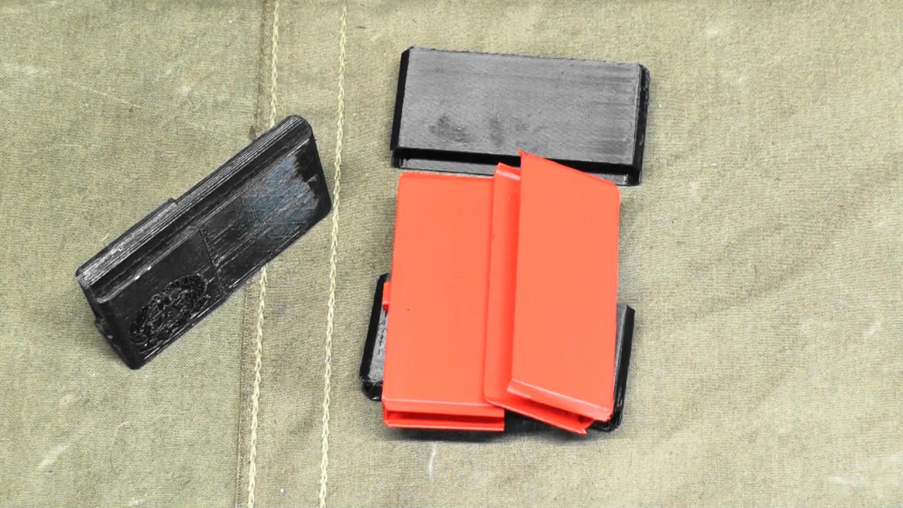 Two 8mm Carcano accessories.