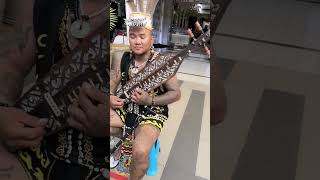 A Sarawak native with Borneo original musical instrument "SAPE". Authentic musical masterpiece.