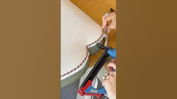 Custom shape king size headboard using a twisted braid cord rather than piping.