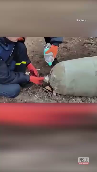 Ukraine Responders Disarm Bomb by Hand With Bottled Water #Shorts