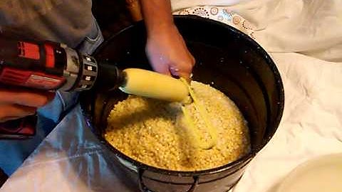 Using a drill to cut corn off of the cob