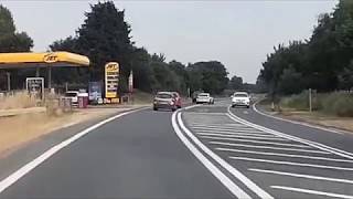 BMW overtaking at junction on double solid white lines