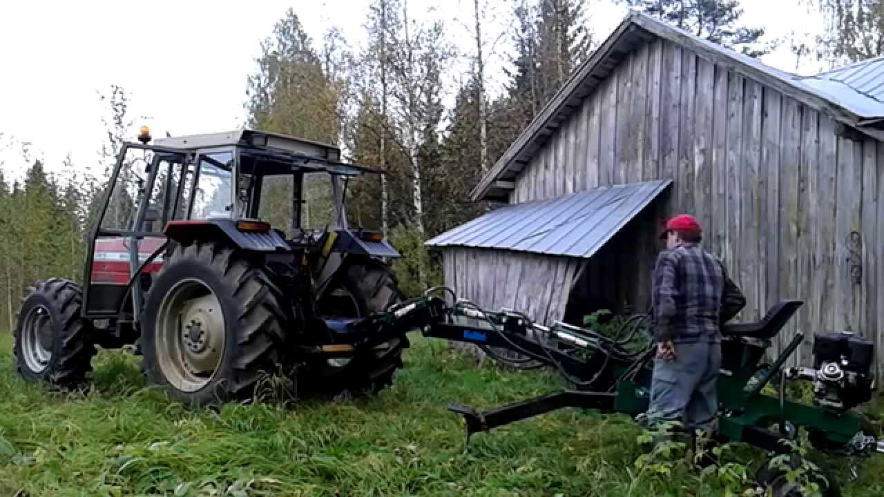 Moving Kellfri miniexcavator with tractor, Kellfri kaivurin siirto
