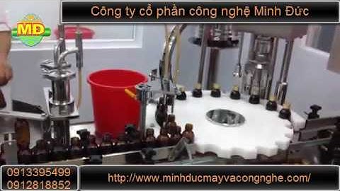 Máy chiết rót xoáy nắp chai dịch chính xác Minh Đức