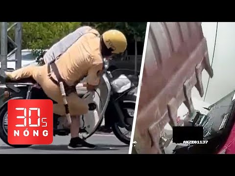 Video Bản tin 30s Nóng: CSGT kẹp cổ, ghì một người xuống... - youtube