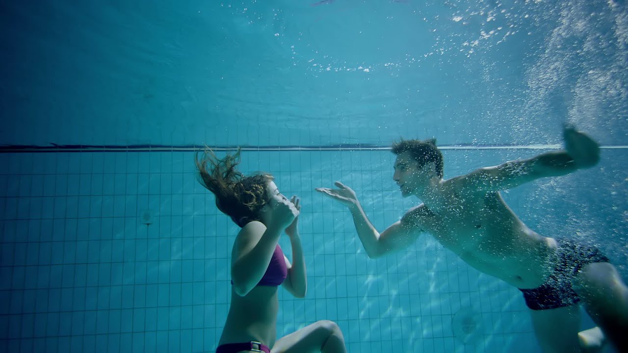 Attractive And Playful Couple Underwater Kissing And Embracing Stock Footage Youtube