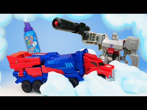Видео про игры Трансформеры! Автобот Оптимус Прайм VS Мегатрон! Заезд по снегу в Автомастерской