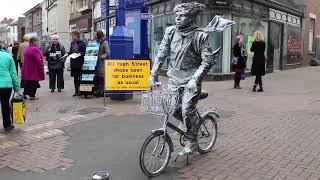 Living Statue and bicycle  South Wales