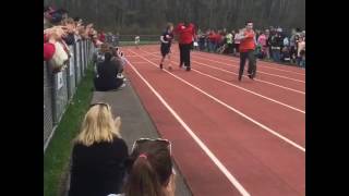 Max Pogoda helping Marvin in special Olympics 50 yard dash