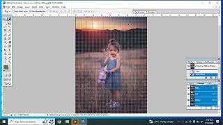Girl in blue dress standing on grass field during sunset photo edit