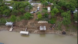 Pumping concrete for this retaining   wall footing by the lake with Muddyfeet