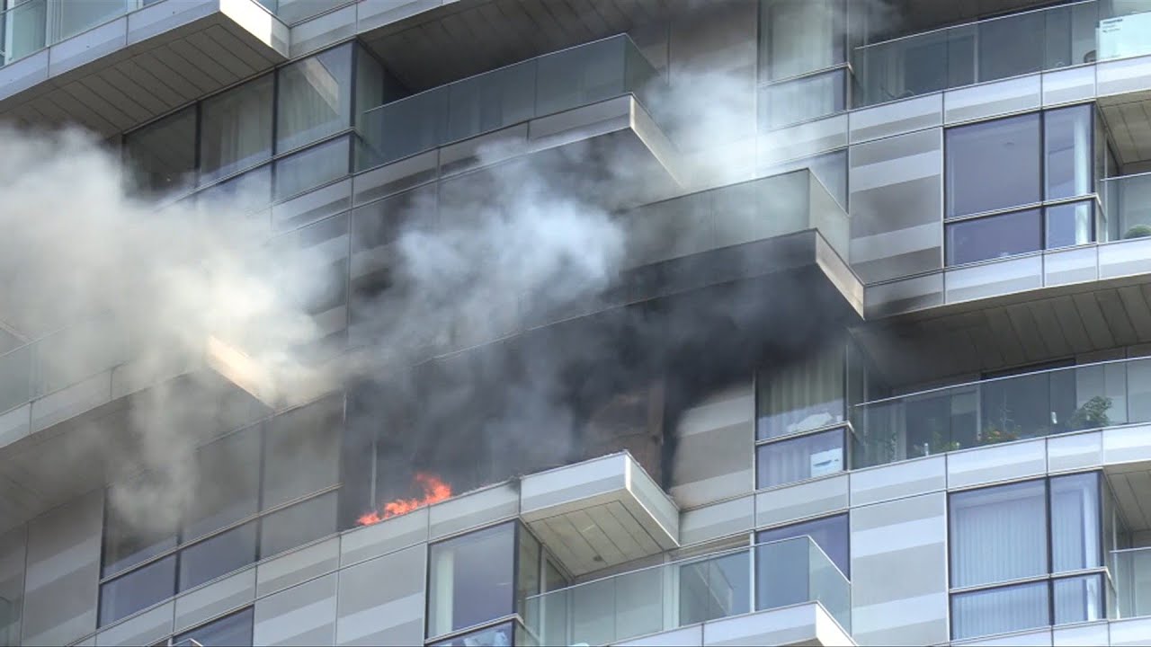 Firefighters tackle blaze in East London apartment block | AFP - YouTube