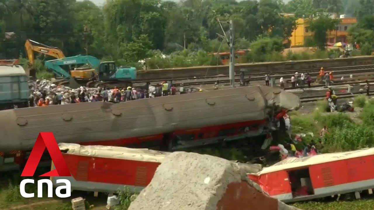 India train crash Hundreds line up outside hospitals to claim bodies of loved ones