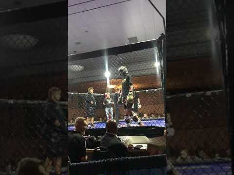 Adam Hunter Stand Up in MMA Cage