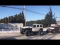 Jeeps and ford raptor rescuing a semi truck