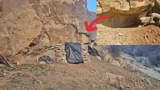 Building a rock shelter in the mountain with minimal equipment