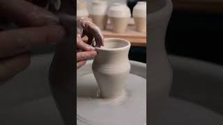 Throwing an Angular Porcelain Vase on the Potter's Wheel