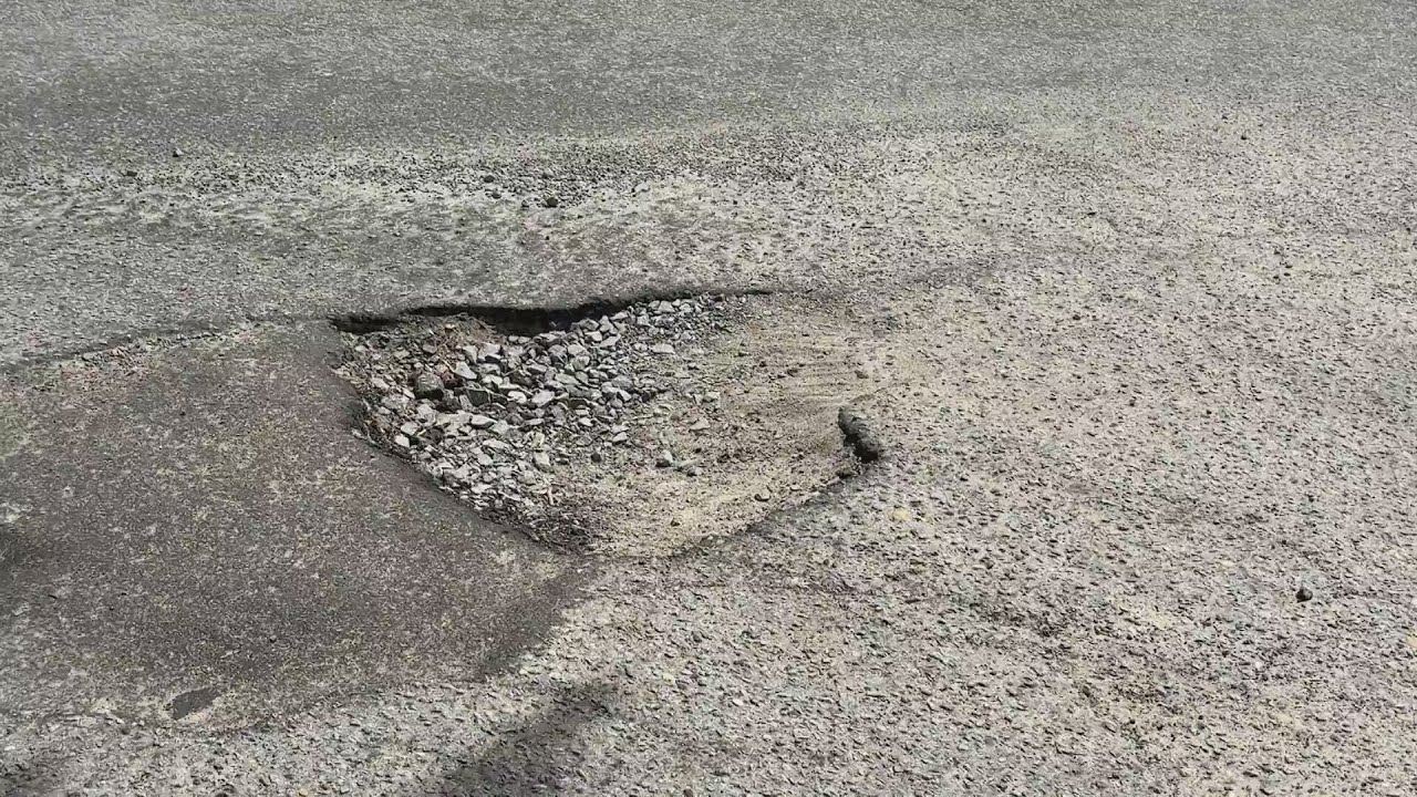 Dangerous pothole reported near Winterville Commons - YouTube