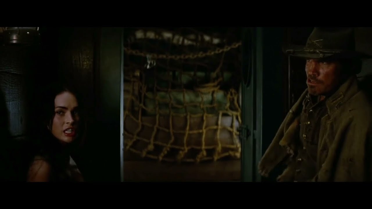 Megan Fox takes down two guys: a knee strike and a punch to the balls. (Jonah hex)