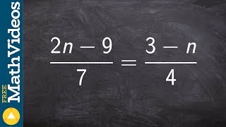 Solve a proportion by multiplying by the LCD ex 13, (2n - 9)/7 = (3 - n)/4