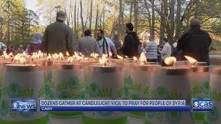 About 100 gather in Cary for vigil for people of Syria
