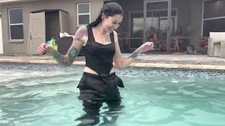 Lexie and Mandy are having fun in the pool fully clothed