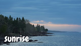 sunrise on Lake Superior on a day sandwiched by a Great Lakes ship (laker) - waves and morning birds