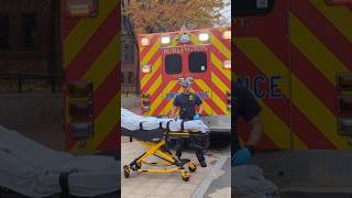 Burlington Fireman Brings a Stretcher into City Hall on Church Street
