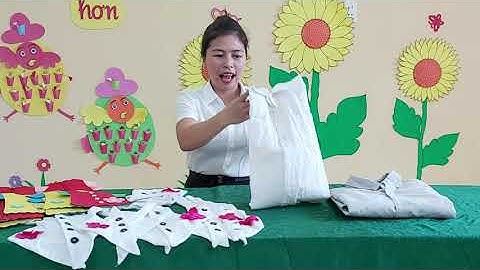 Hướng dẫn trẻ cài cúc áo